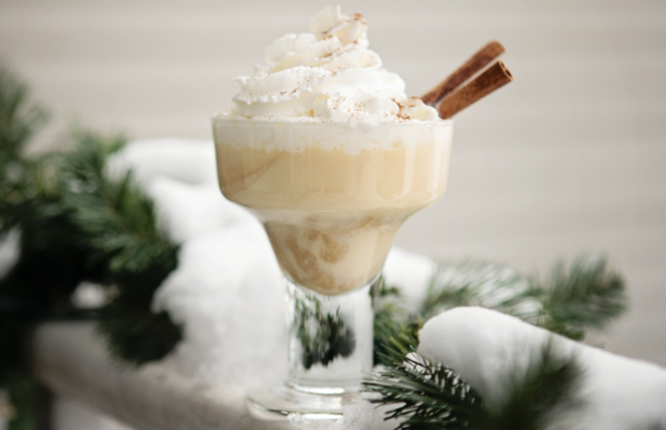 Egg Nog Mudslide Topped with Whipped Cream and Cinnamon Sticks