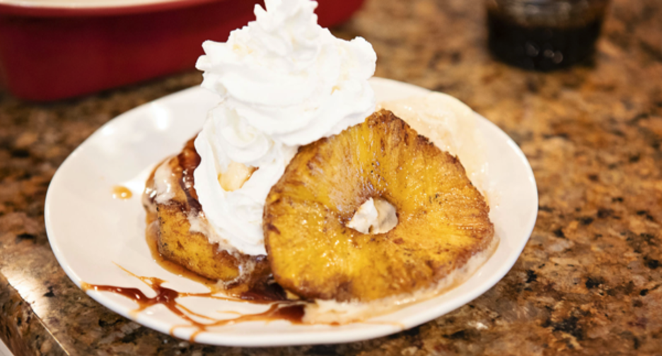 Pit Barrel Grilled Boozy Pineapples Topped with Rum Sauce and Ice Cream