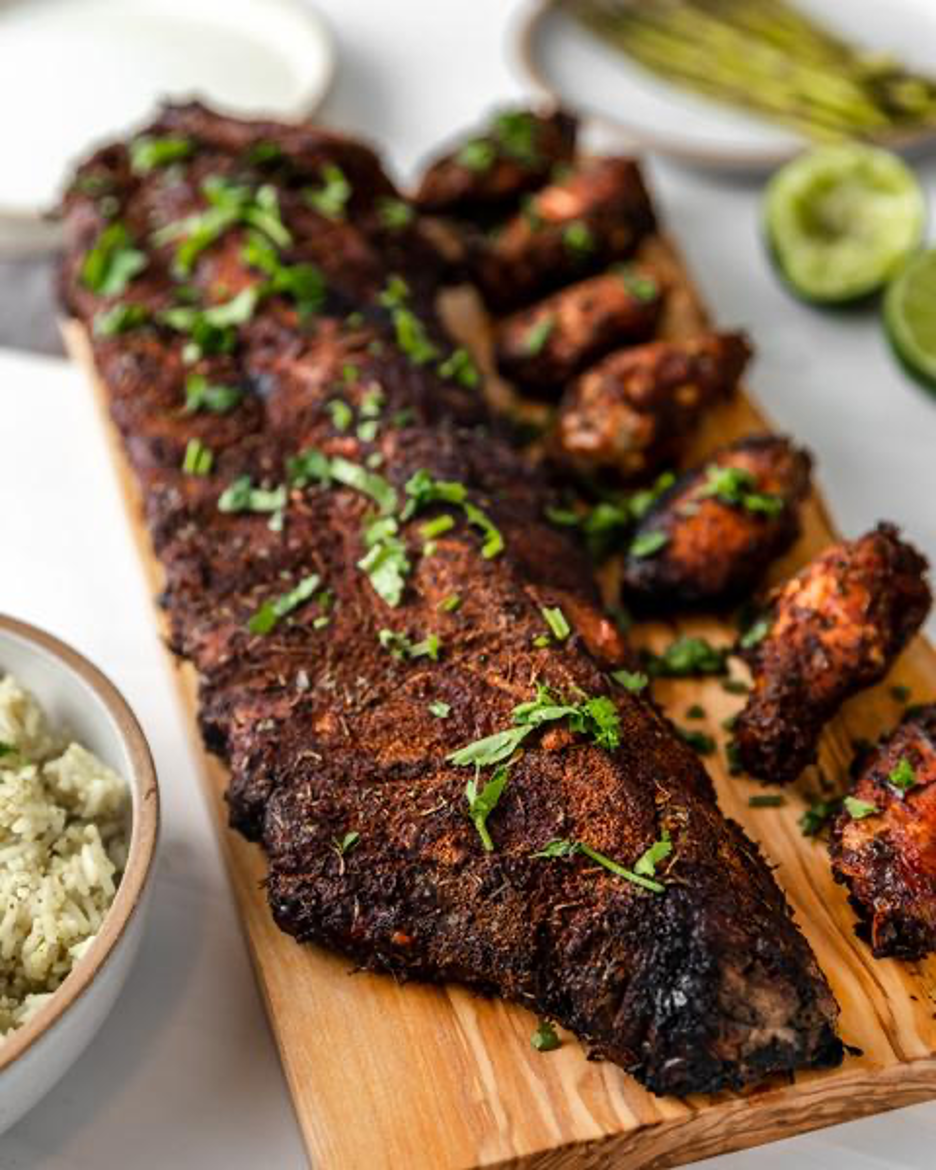 Rack of Jamaican Jerk Ribs with Wings on Cutting Board