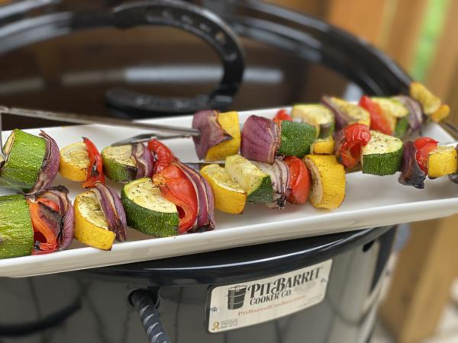 Vegetable Kebabs on Skewers Resting on Pit Barrel Cooker