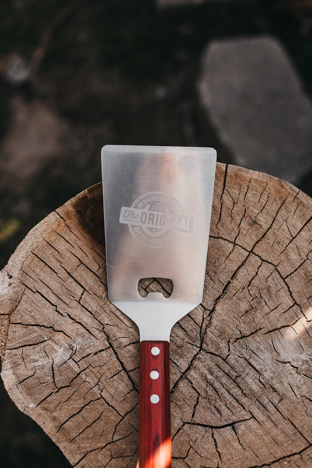 Cave Tools BBQ Spatula – Heavy Duty Stainless Steel With Serrated Edge & Bottle Opener – 3-in-1 Grilling Tool, Dishwasher Safe, 25 Recipes Included